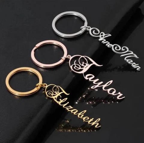 Script Name Keychain With Decorative Swirl Above Initial