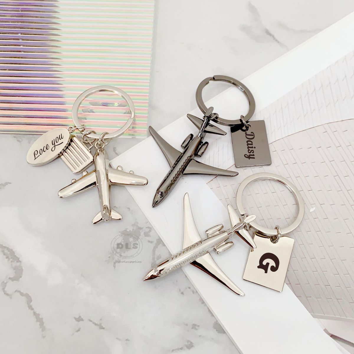 The Global Voyager Airplane Charm & Initial Tag Keychain - Image 1