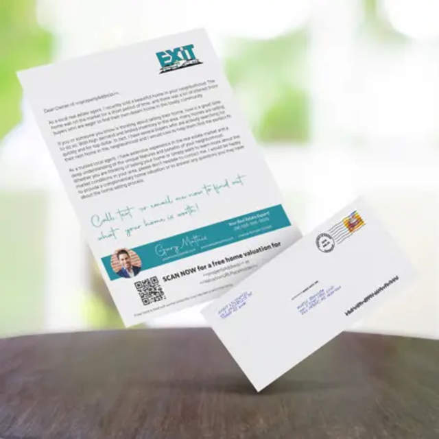 An Exit Realty letter on a wooden table.