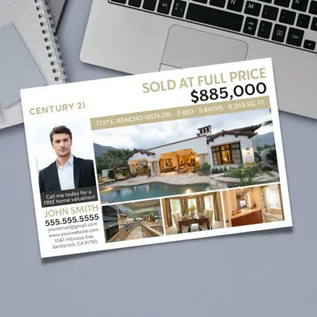 Century 21 postcard with a laptop in the background.