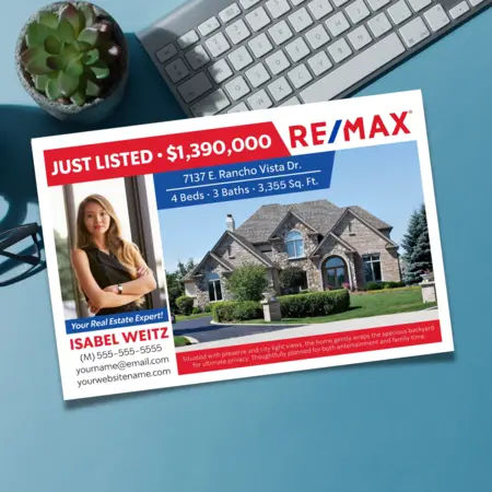remax postcard in front of a keyboard with blue background