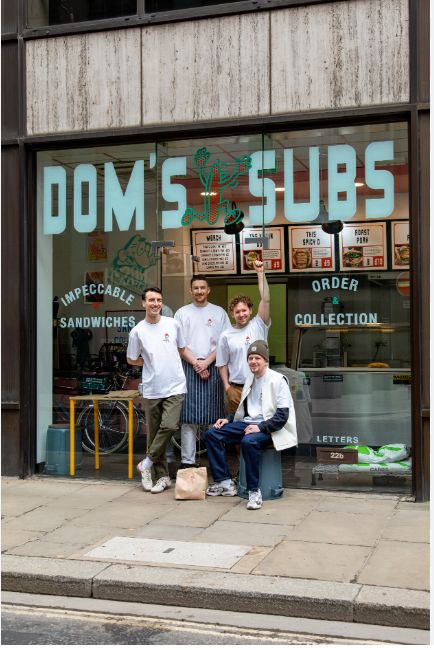 The team outside Dom’s Subs