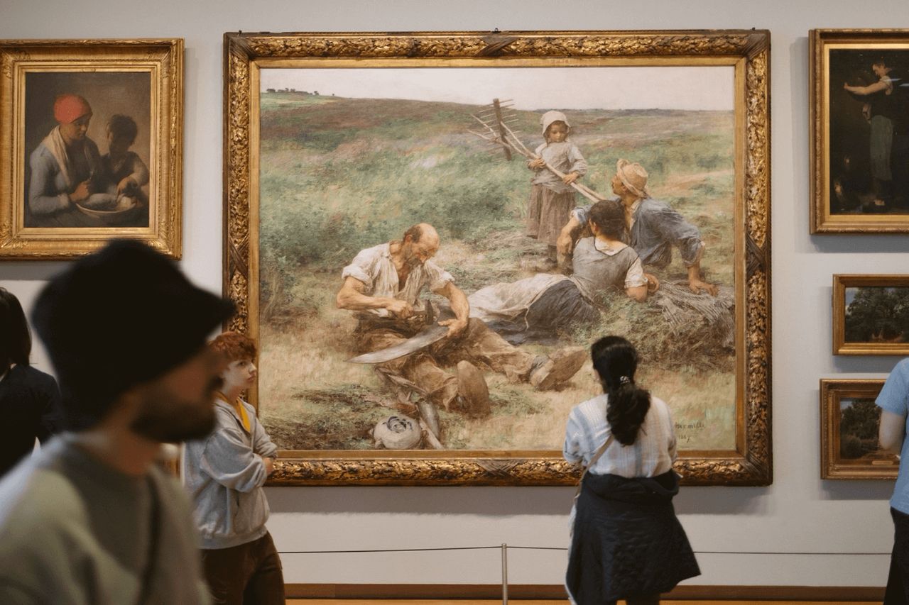 People looking at artwork at the Van Gogh Museum ⌘