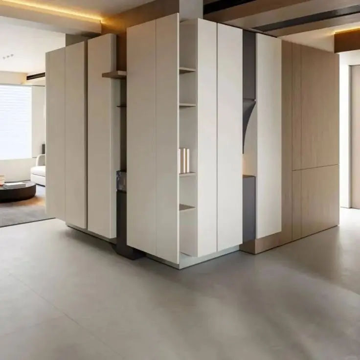 This may contain: an empty room with white walls and cabinets