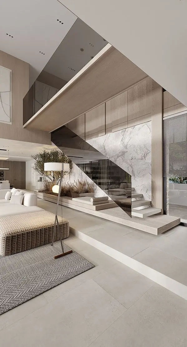 This may contain: a modern living room with stairs leading up to the second floor and an open staircase