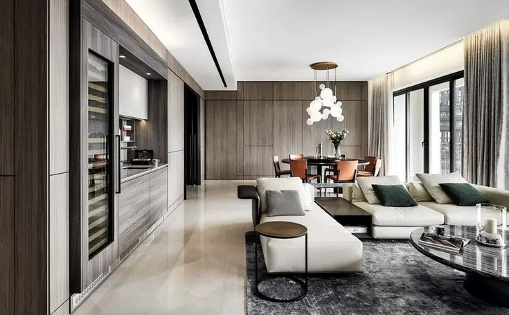 This may contain: a living room filled with furniture and lots of windows
