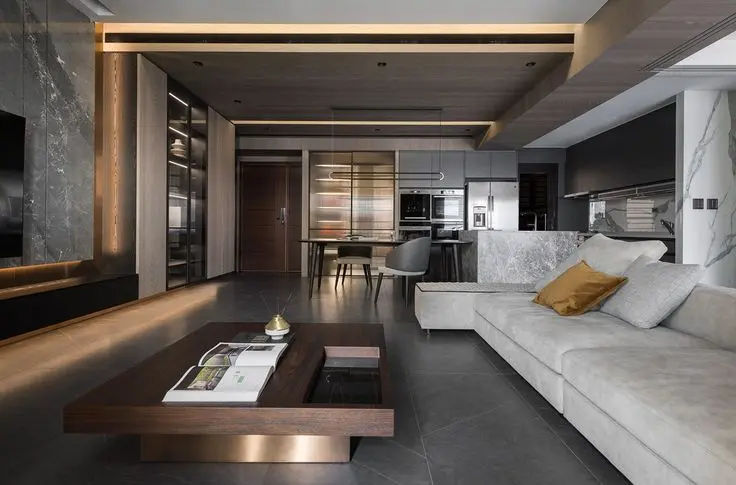 This may contain: a living room filled with furniture and a flat screen tv mounted to the wall above it