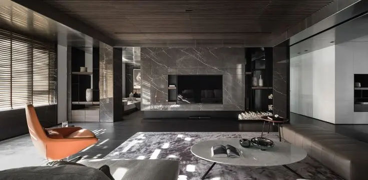 This may contain: a modern living room with marble walls and flooring