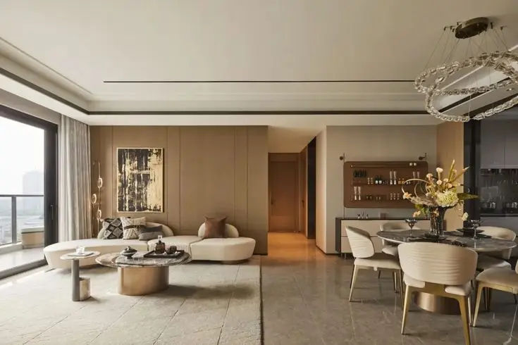 This may contain: a living room filled with furniture and a large window