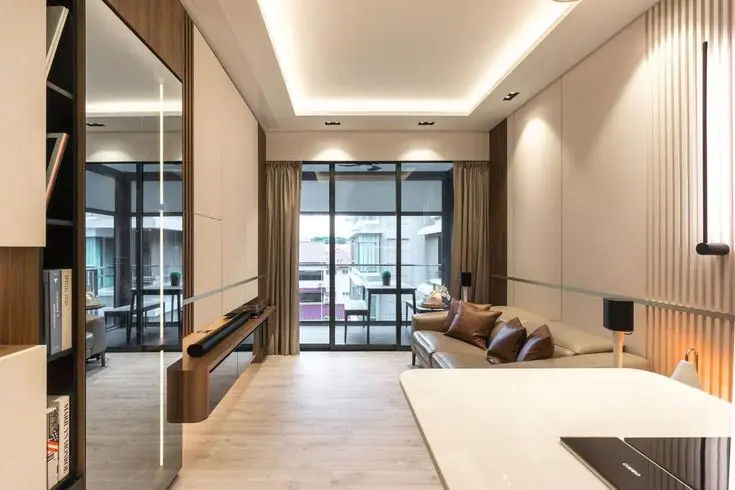 This may contain: a living room filled with furniture next to a kitchen