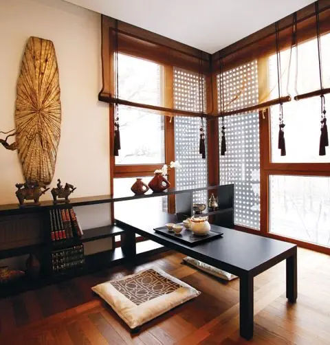 This may contain: a living room with wooden floors and large windows