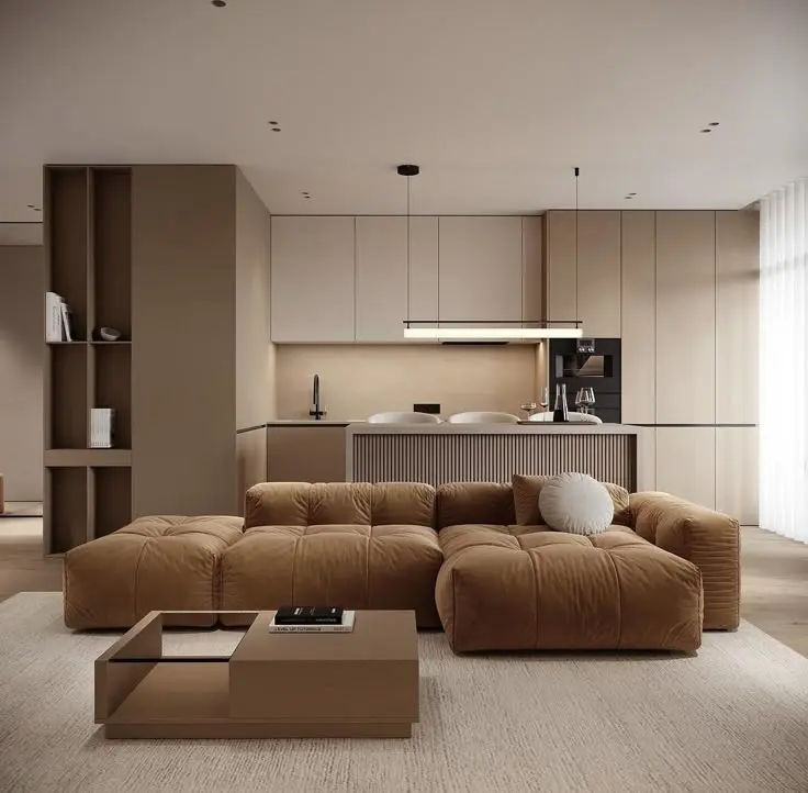 This may contain: a living room filled with lots of furniture and a large brown couch in front of a window