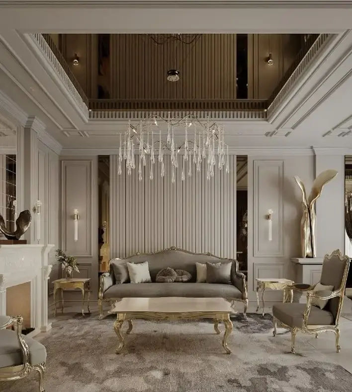 This lounge radiates luxury with its neoclassical beauty, including gold-accented furniture, a big chandelier, and rich wall and ceiling details. The neutral tones and velvety textiles add to the enhanced atmosphere, while the high ceiling and complex décor convey a feeling of timeless elegance. #neoclassicInterior #luxuryInterior #luxuryLivingRoom #neoclassicLivingRoom #homeDecor #homeInterior #ModernLuxury #reception #wallTreatments