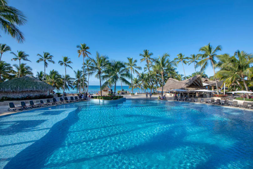 Aerial view of the swimming pool with Viva logo and the beach at Viva Dominicus Beach by Wyndham