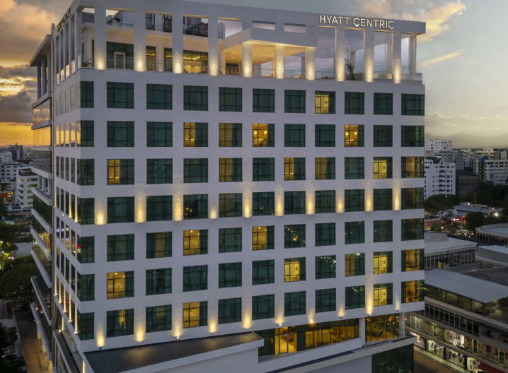 Exterior facade of the luxury hotel Hyatt Centric Santo Domingo during sunset in the Dominican Republic.