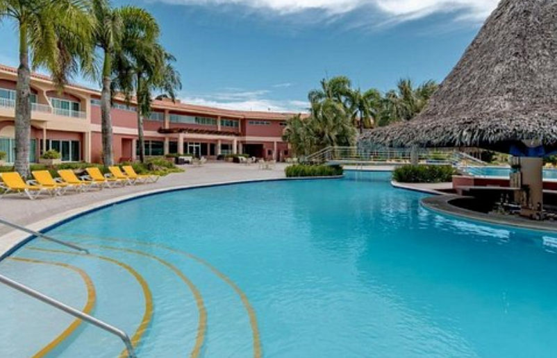 Aerial view of the swimming pool and facilities at Hodelpa Garden Suites in Juan Dolio