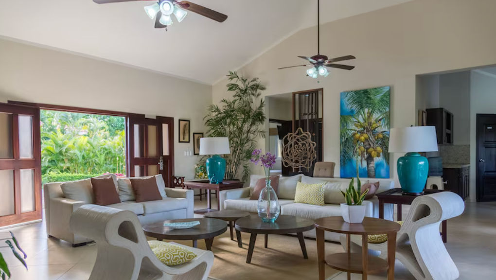 Luxury vacation villa in Dominican Republic featuring a private swimming pool, covered terrace, and Mediterranean architecture