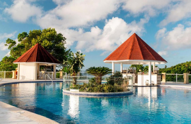 Aerial view of Eurostars Grand Cayacoa hotel in Samana, showcasing its cliffside facilities and private beach