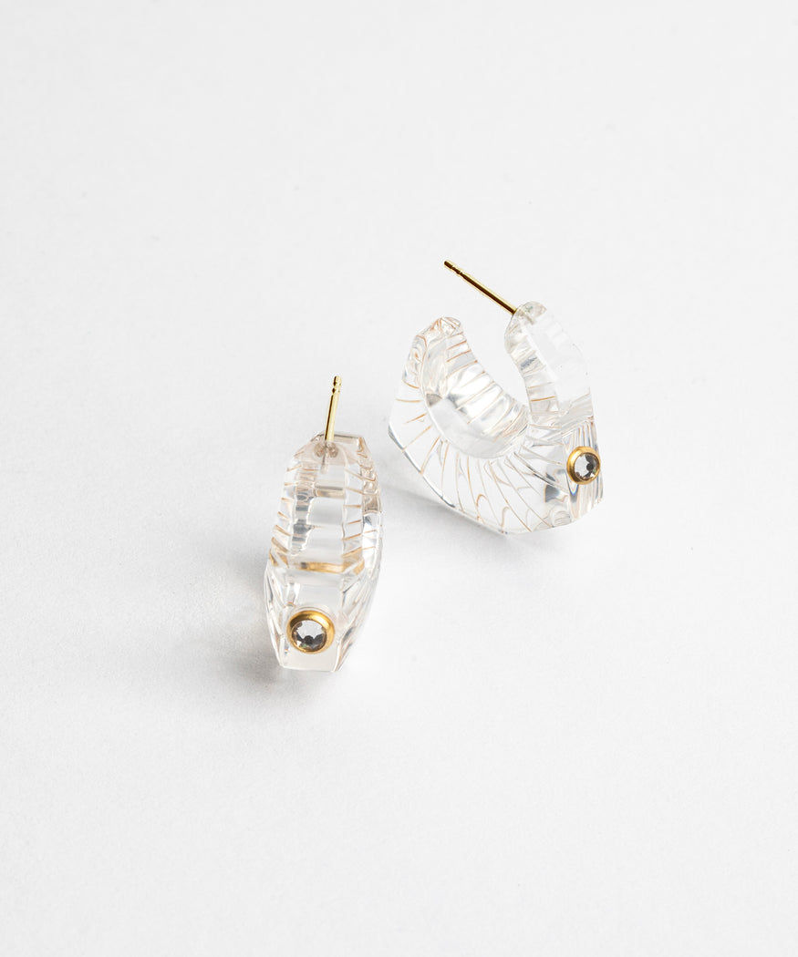 A pair of WALD Berlin Crystal Earrings from Germany on a white surface.