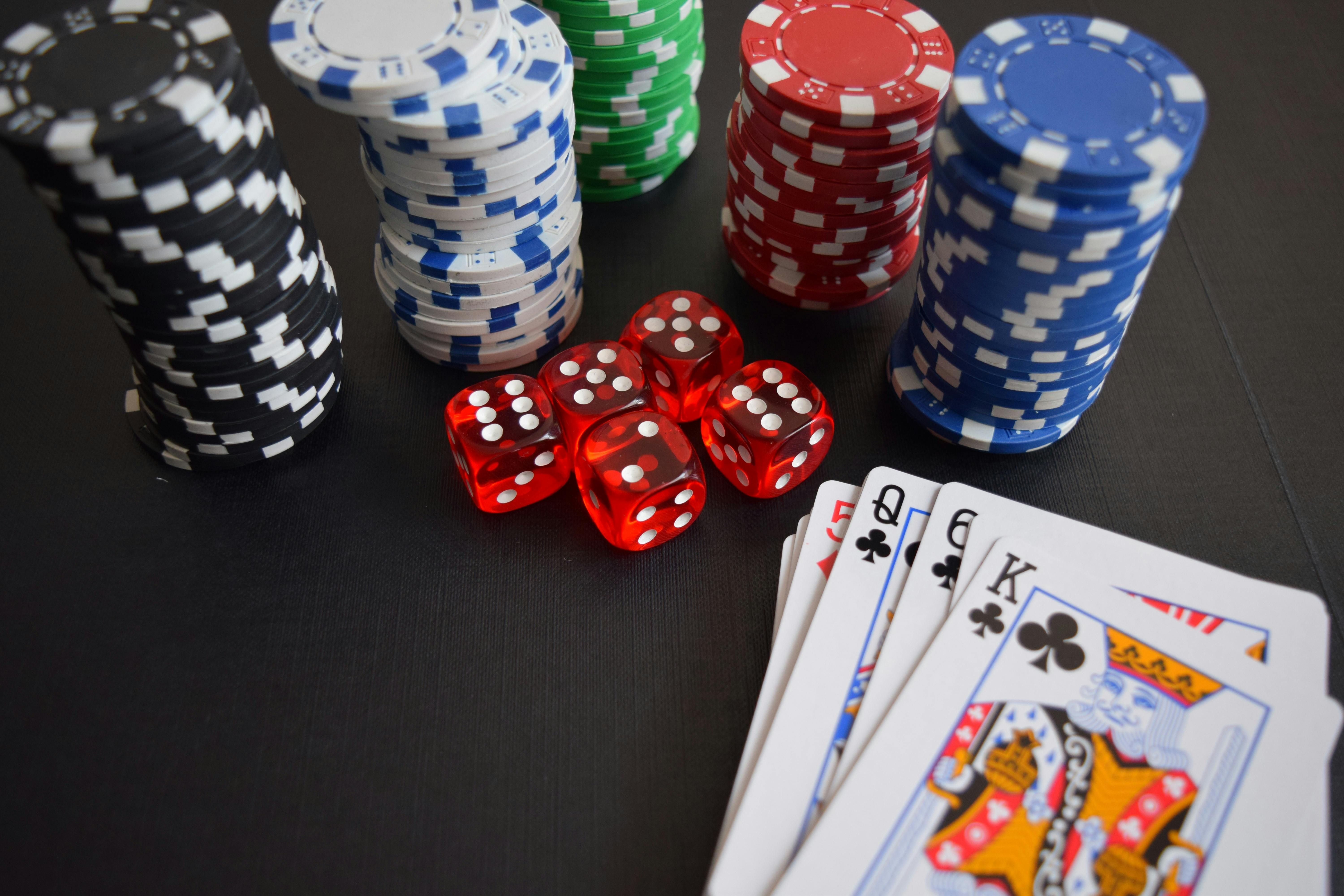 Dramatic poker table scene with chips and cards