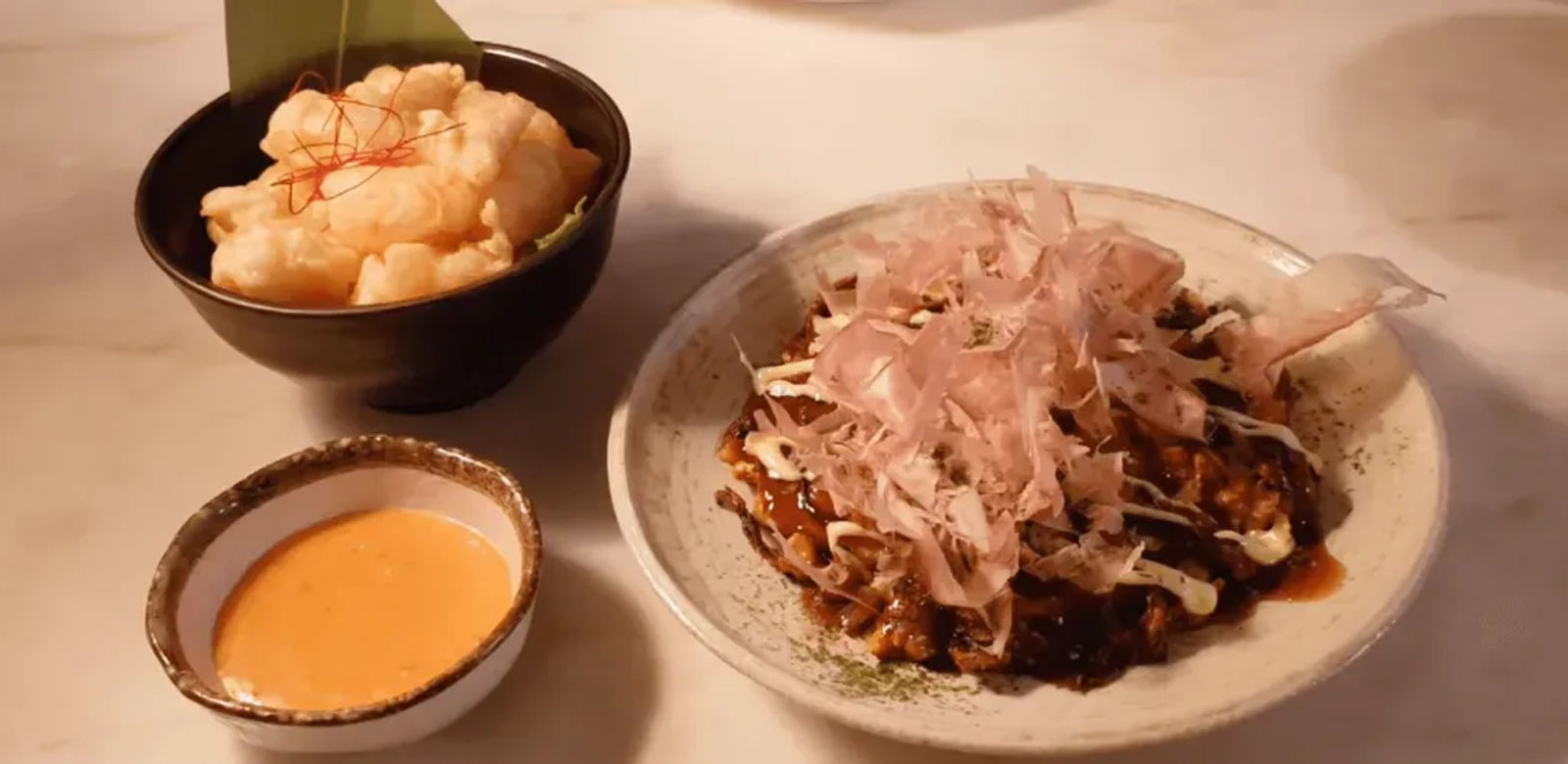 Okonomiyaki topped with bonito flakes