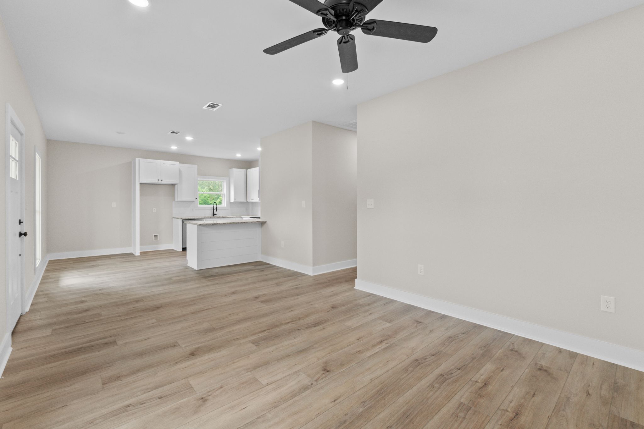 New Construction For Sale in Oak Grove – 321 Nobles Rd, Sumrall MS 1 Open-concept kitchen and living room at 321 Nobles Rd