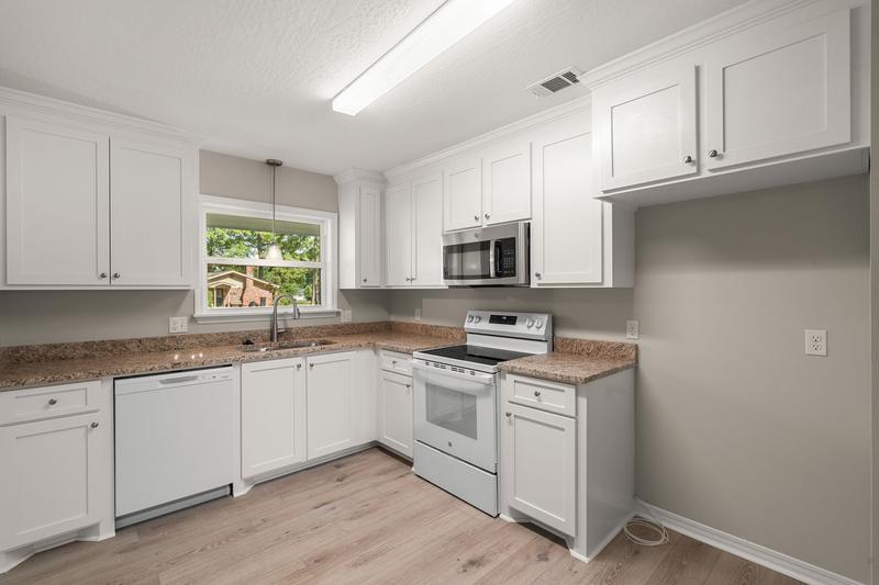 Kitchen with white cabinetry and appliances, 111 Springhill Drive, Westover, Hattiesburg, MS
