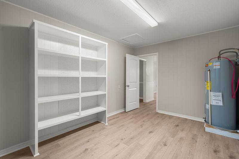 Laundry room with shelving and water heater, 111 Springhill Drive, Westover, Hattiesburg, MS