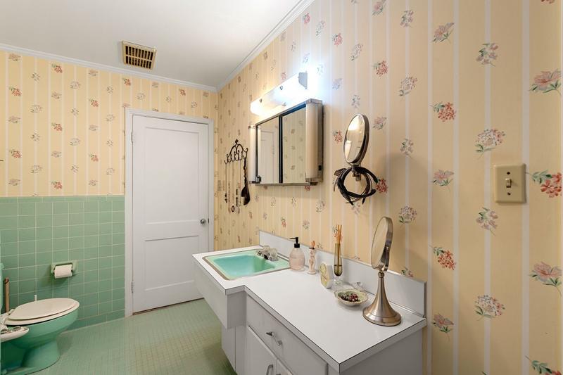 Second bath with original mint tile and green fixtures