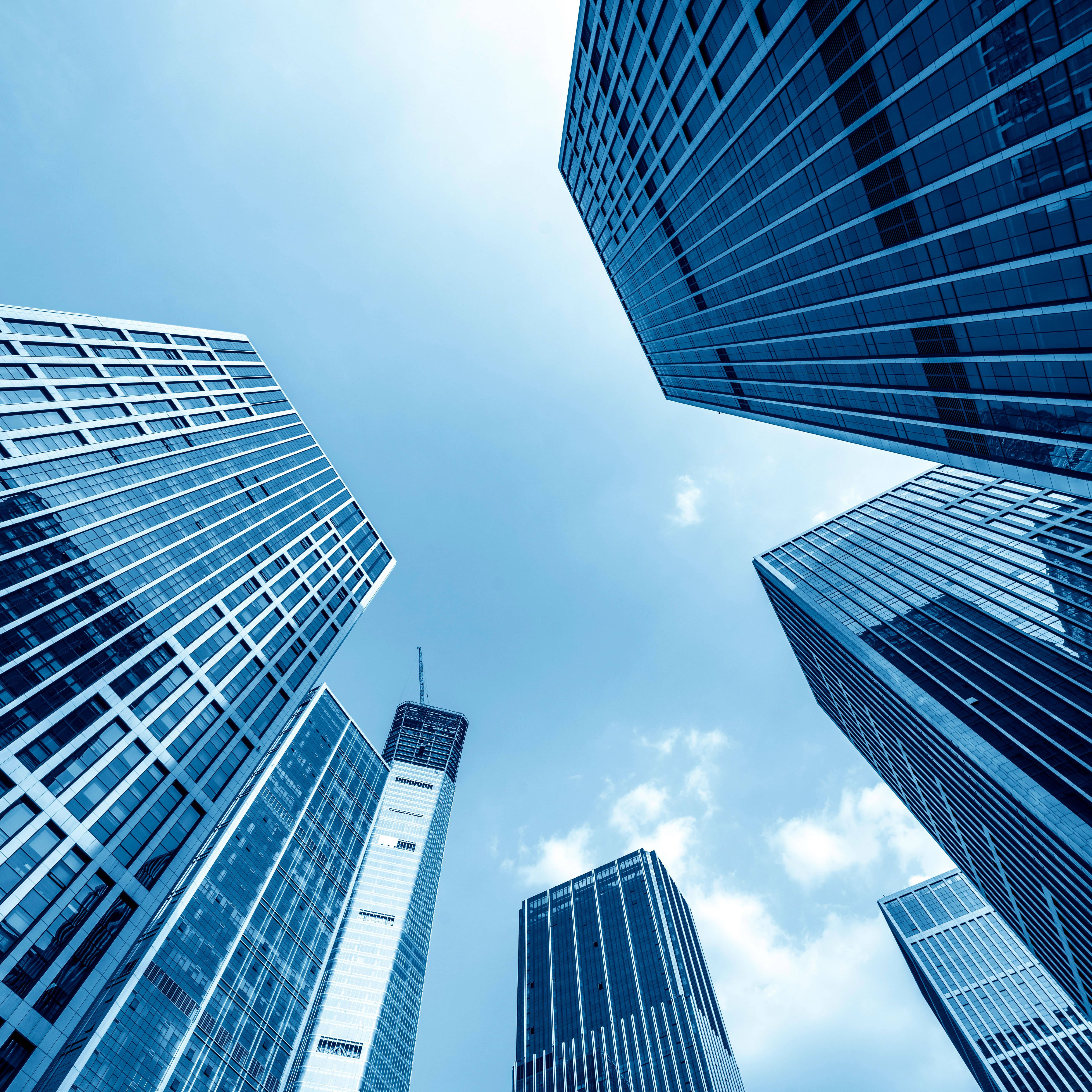 Modern skyscrapers tower into the sky, symbolizing urban growth and architectural innovation.