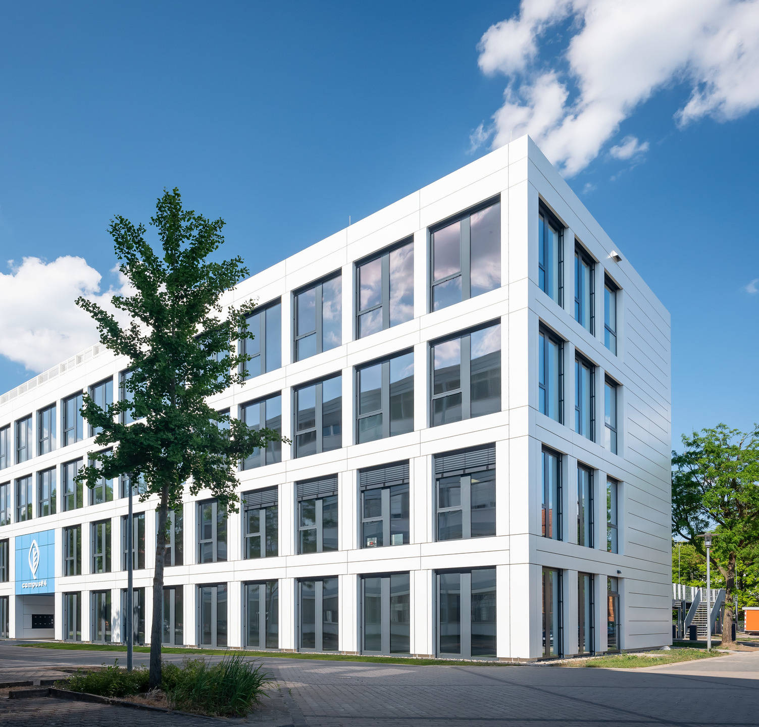 Exterior view of a large logistics building in Bremen with C3 branding and loading ramps.