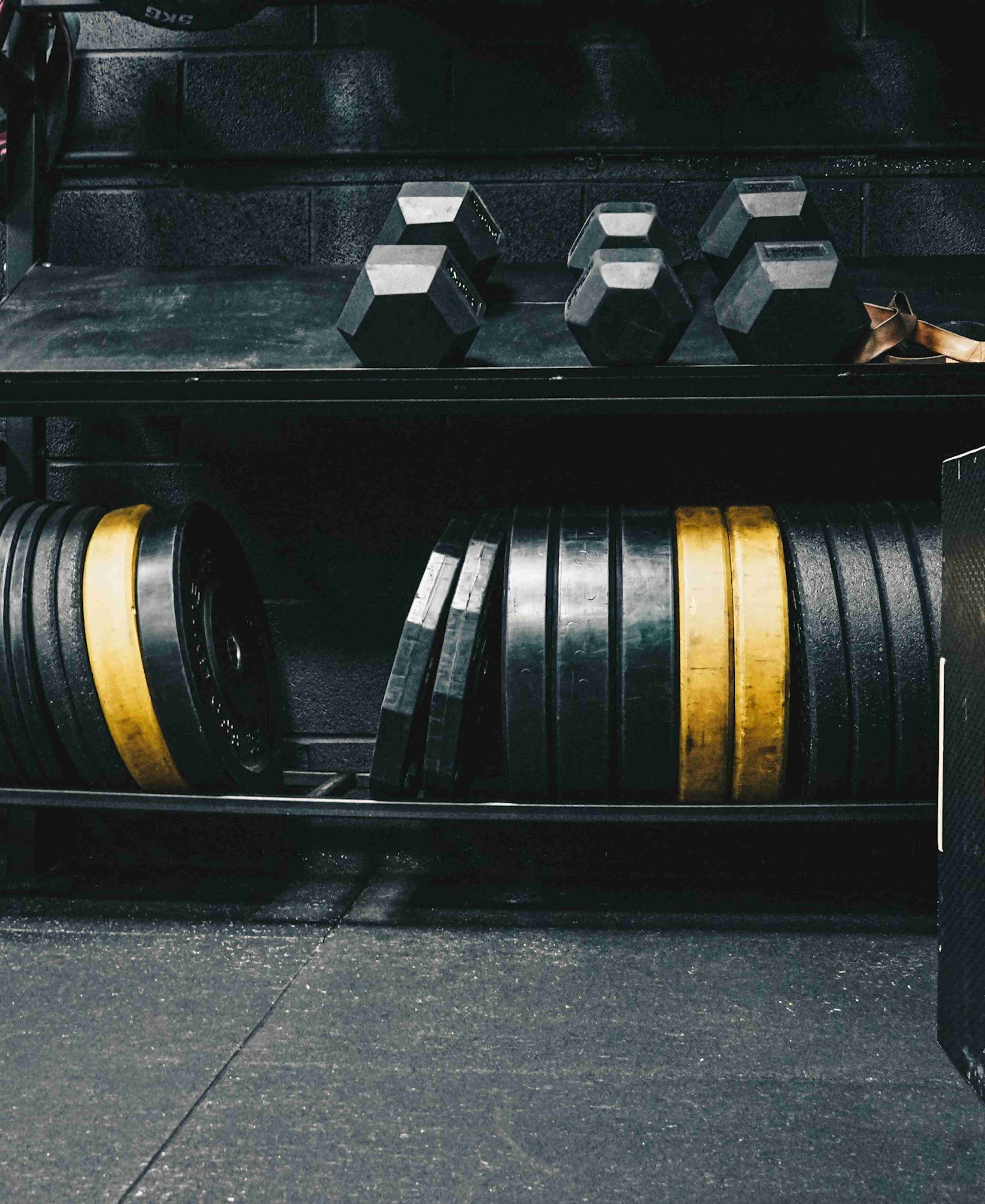 A room filled with lots of different types of exercise equipment