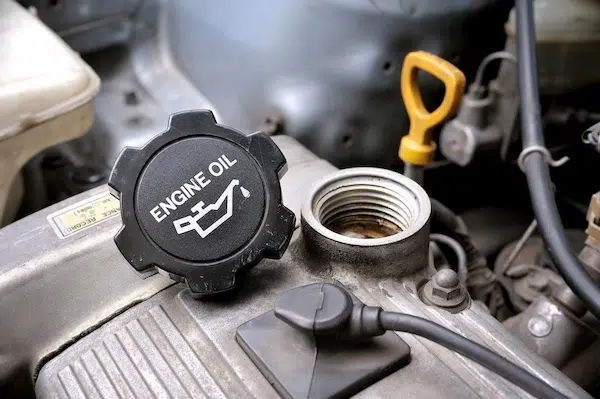 how long can a car go without an oil change adding engine oil