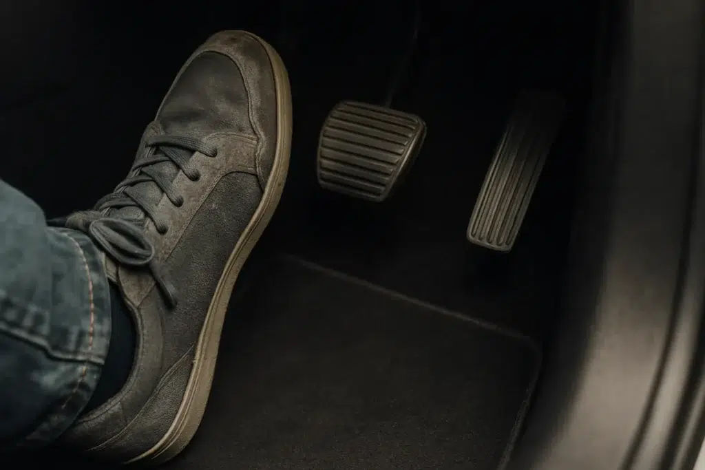 Why Is My Brake Pedal Soft or Going to the Floor? Driver pressing a brake pedal that sinks toward the floor