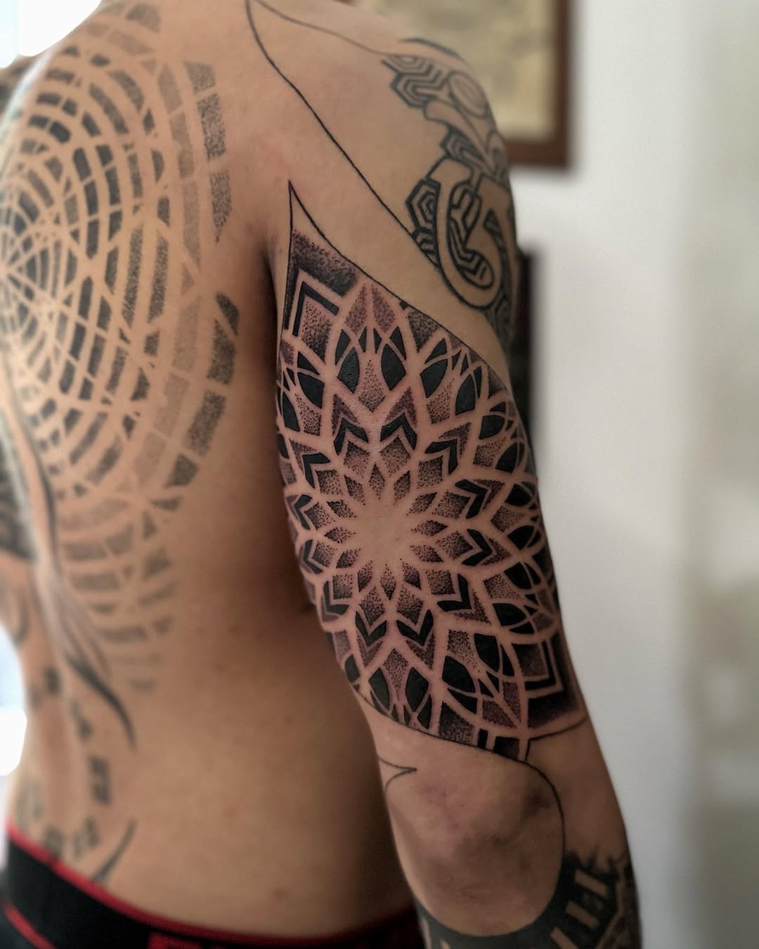 Geometric tattoo by Giada