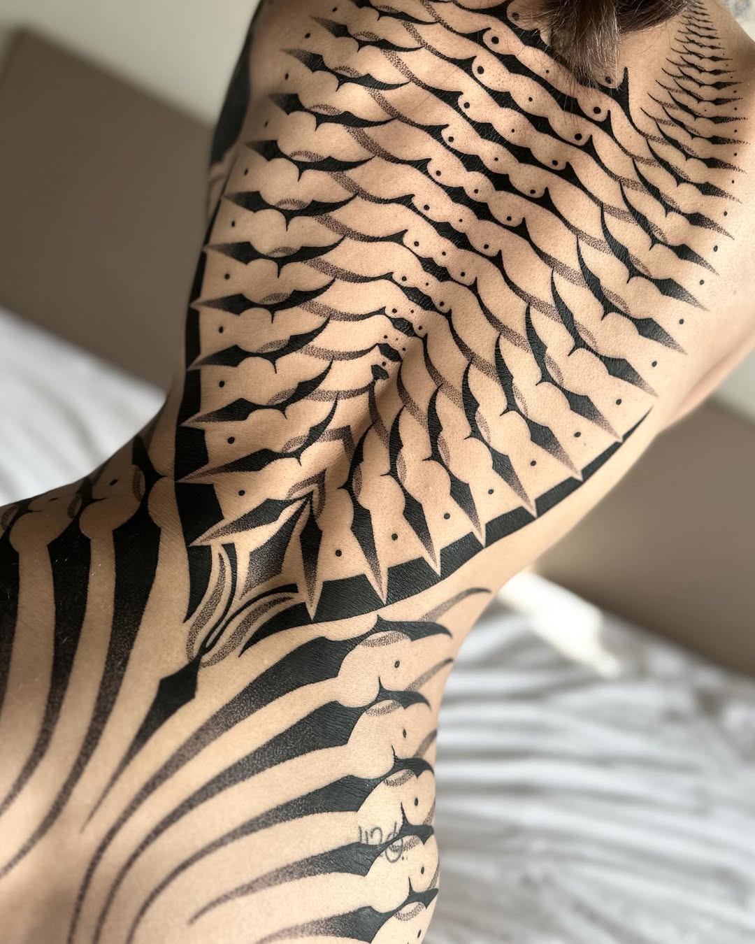 Geometric tattoo by Dana Sha