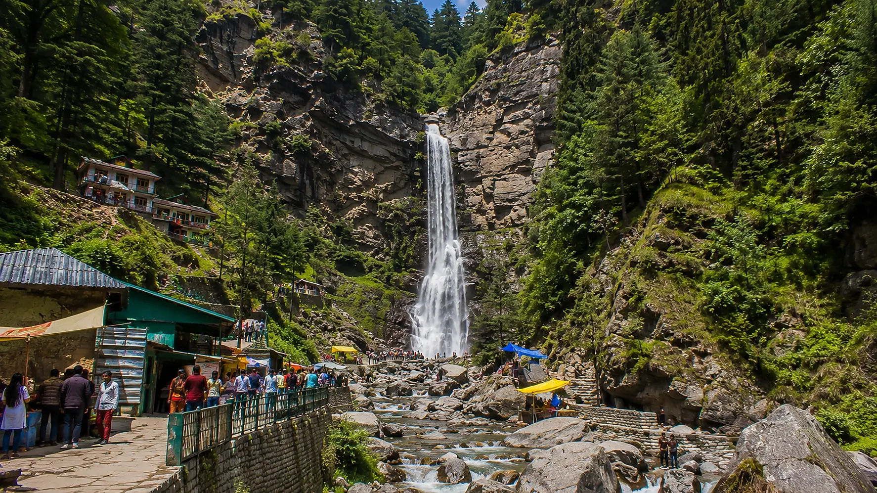 Jogini Waterfall near Manali surrounded by green forests