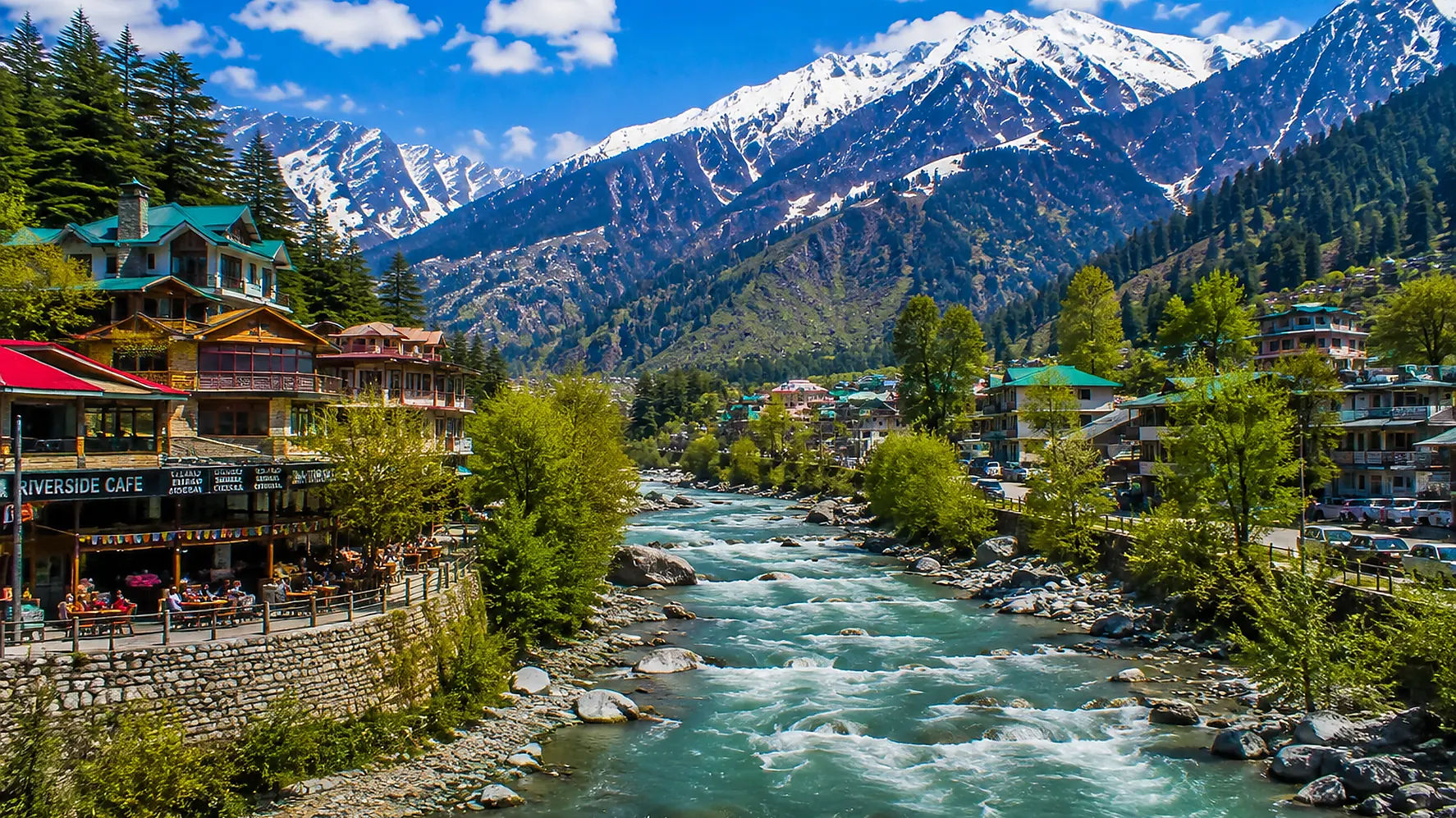 Beautiful panoramic view of Manali with snow-covered Himalayan mountains and Beas River