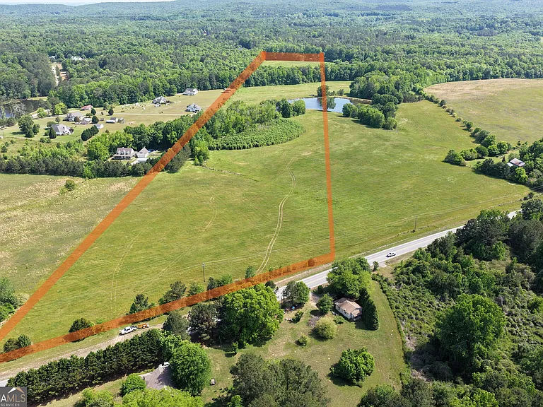 Aerial view of the spring-fed pond and surrounding property