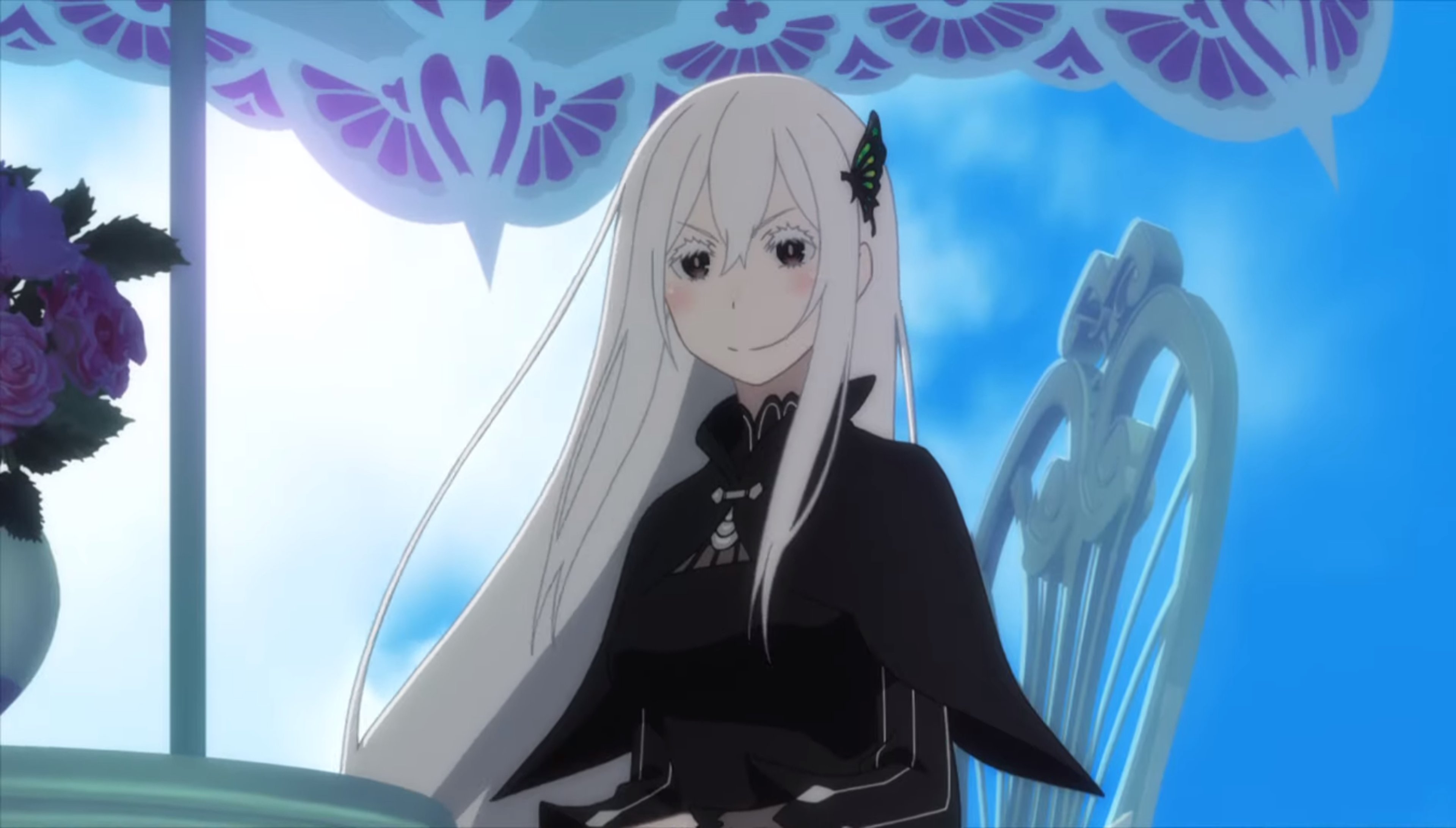 A young woman with pale skin, black eyes, and long white hair wearing a black dress