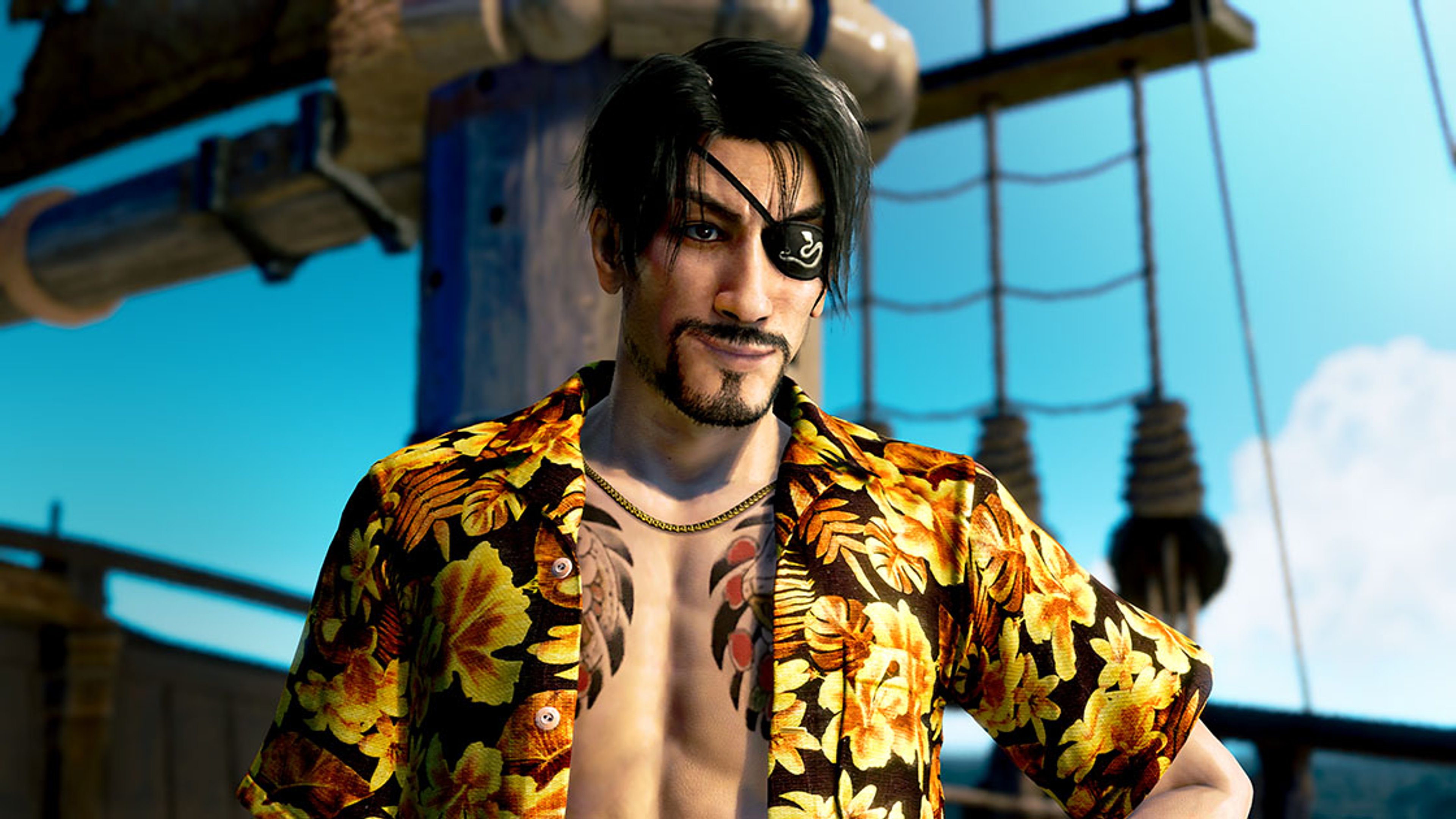 A man with a distinctive, intense appearance wearing a floral-patterned shirt