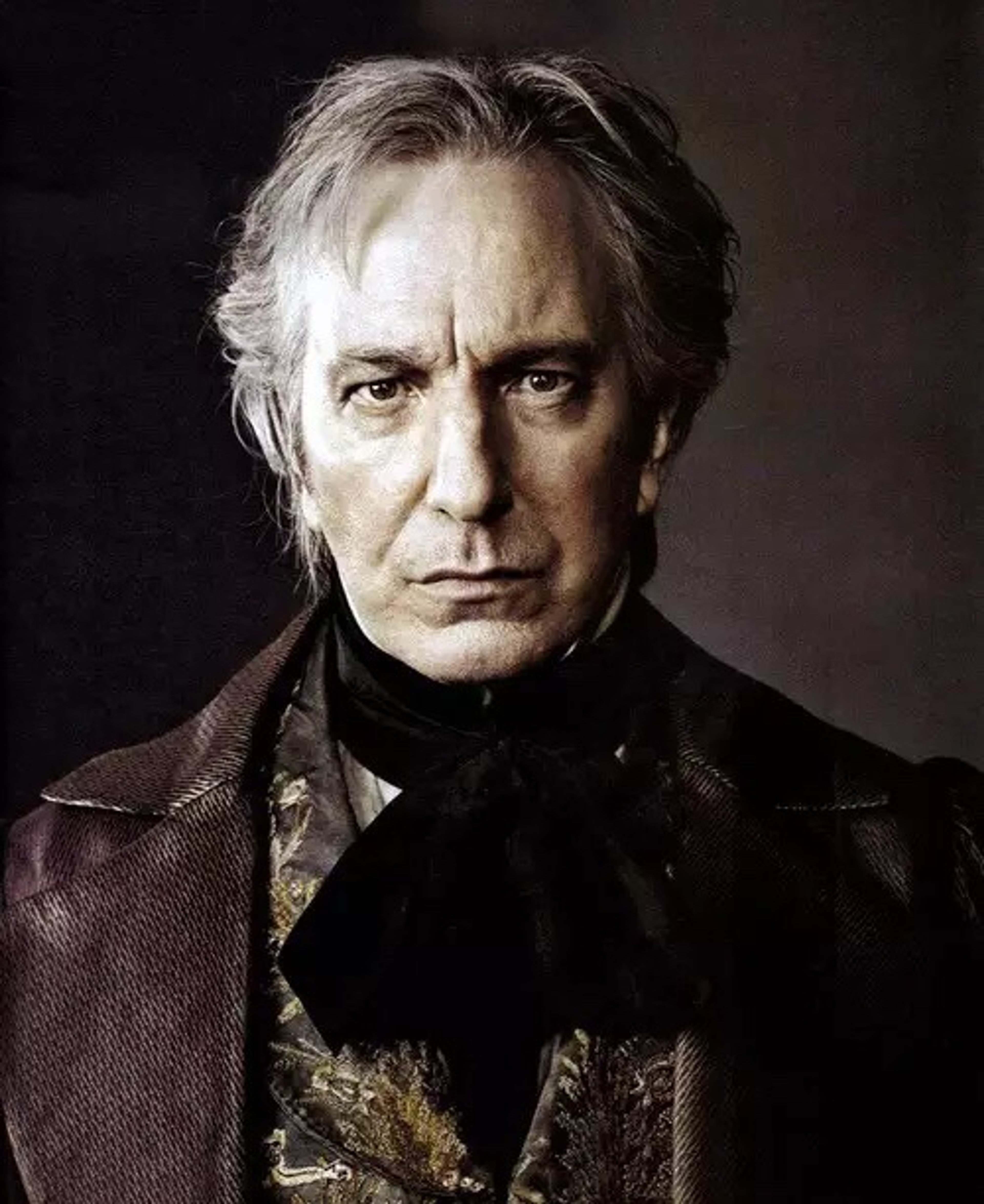 A portrait of an older, distinguished-looking man with gray hair and a serious expression.