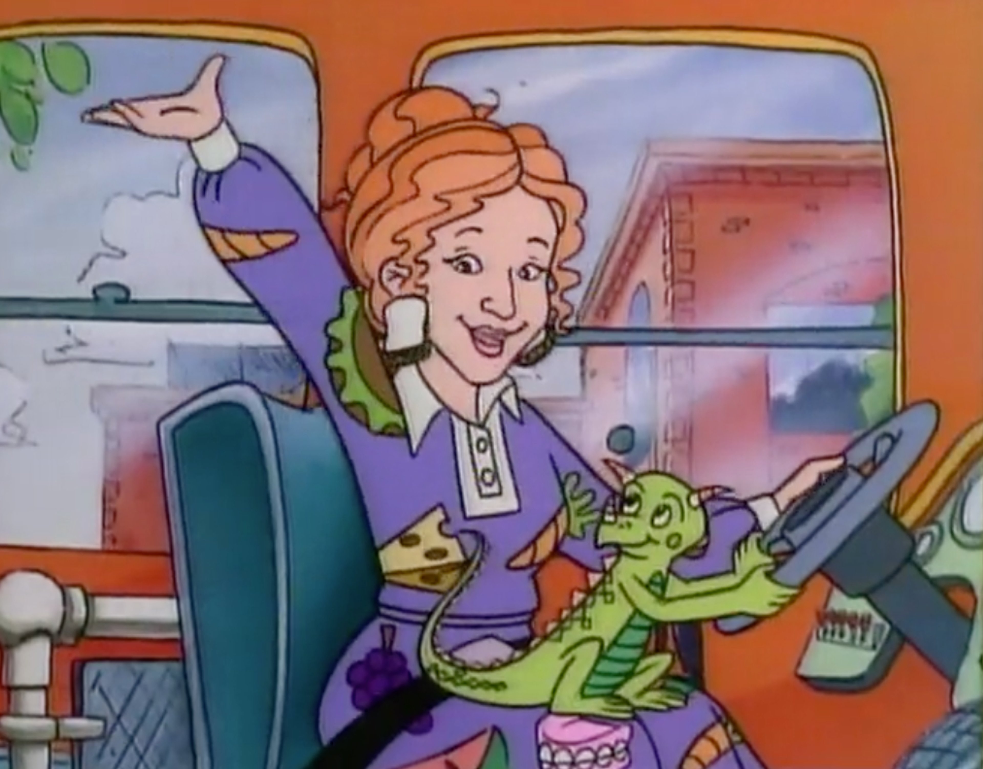 An animated woman with red hair and a purple dress holding a small green creature