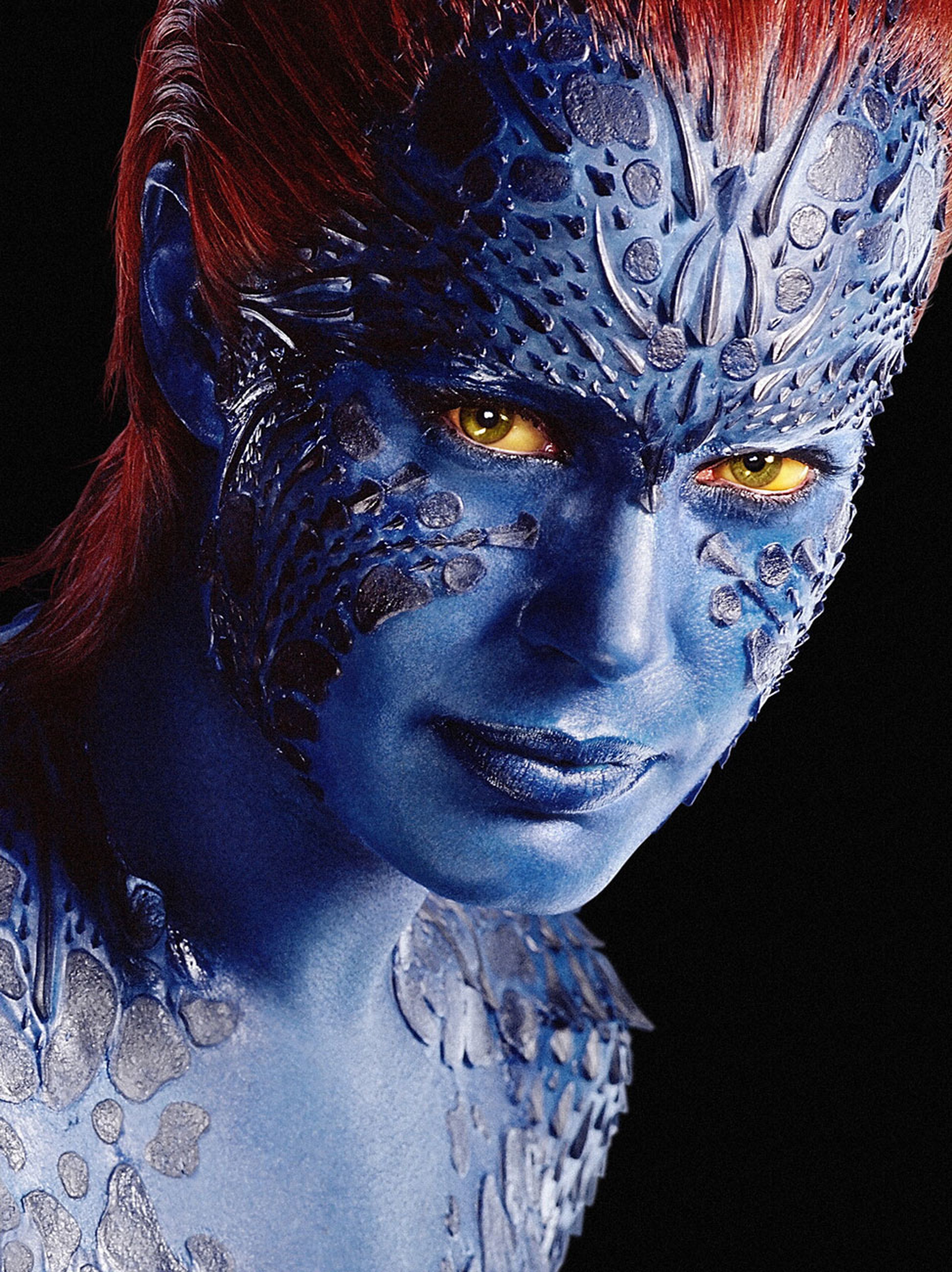 A blue-skinned, reptilian-looking humanoid character with red hair and yellow eyes