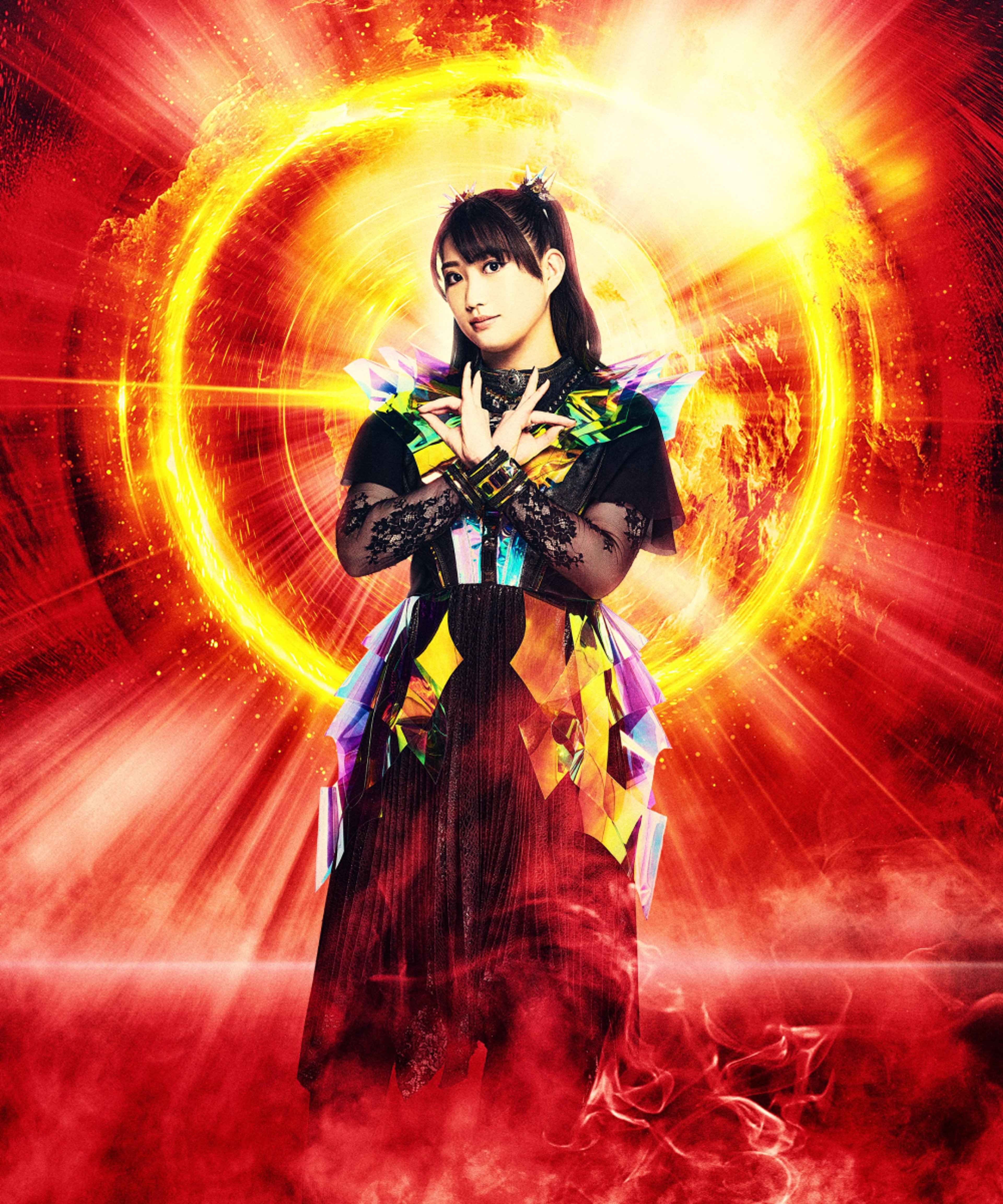 A young woman in a colorful, theatrical outfit standing in a dramatic pose against a fiery, cosmic background.