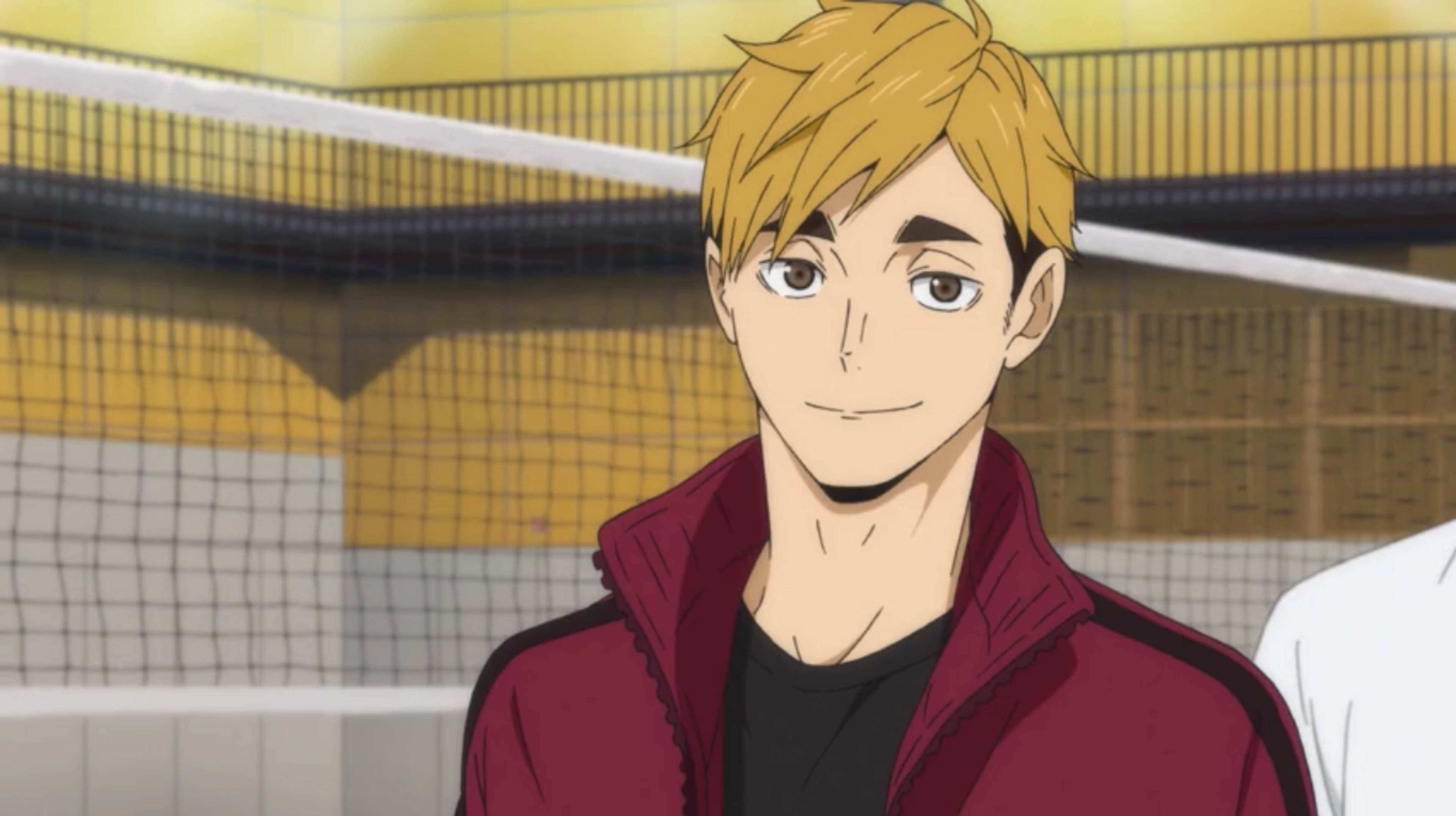 A young man with blonde hair wearing a red jacket, who appears to be a professional volleyball player.