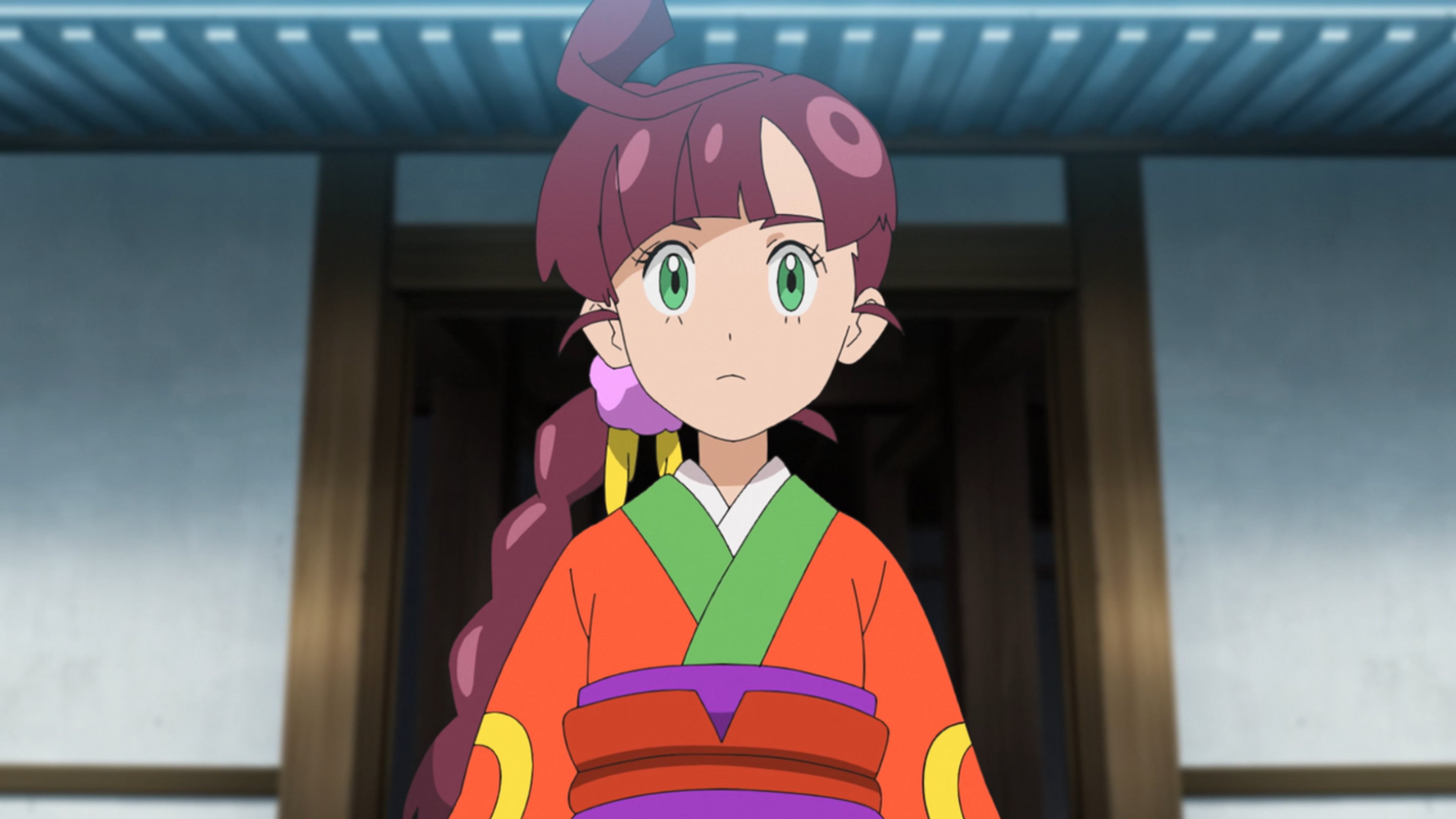 An anime-style character with pink hair wearing a green and orange kimono-style outfit, standing in front of a traditional Japanese-style building.