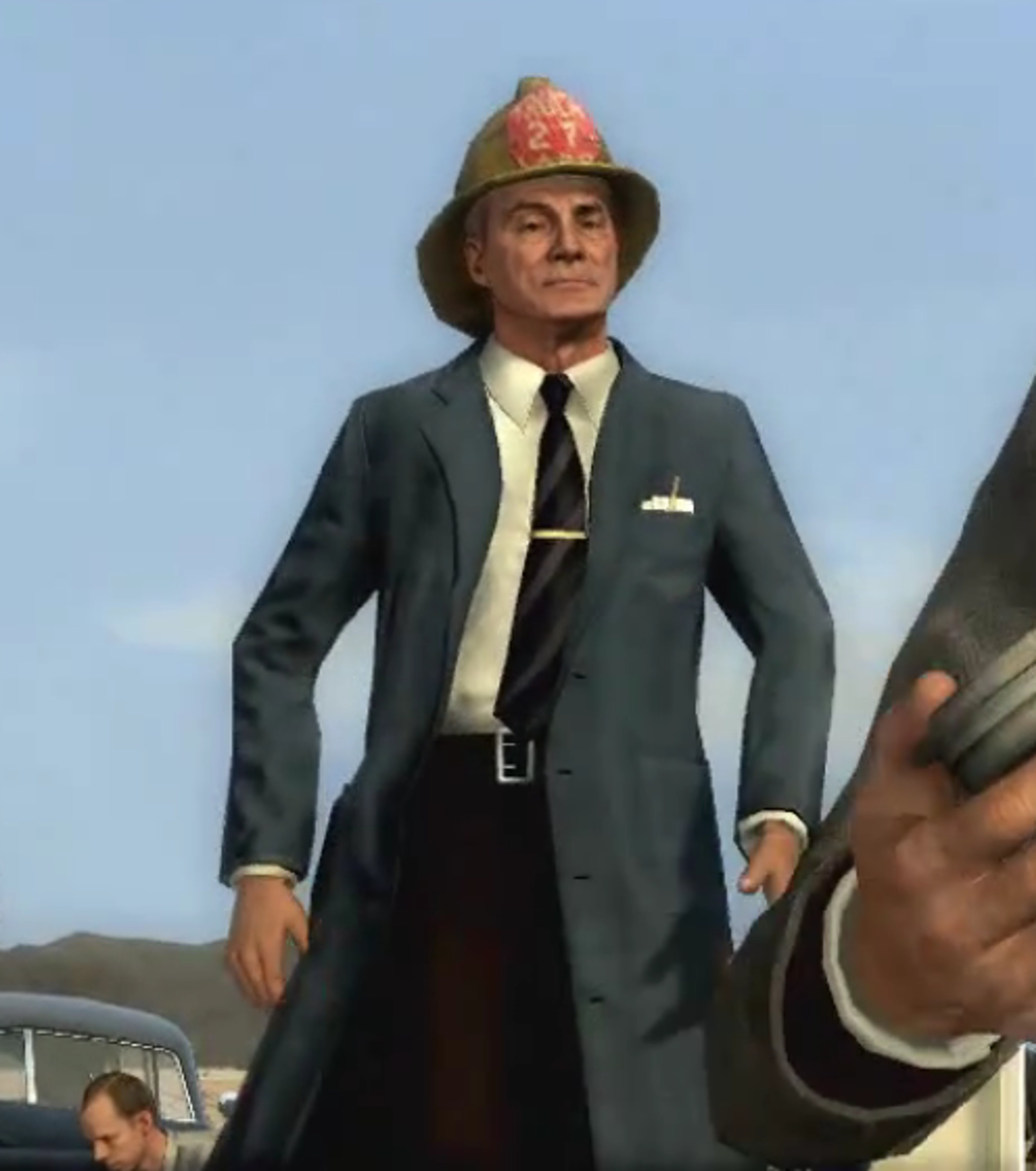 A firefighter in uniform with a serious expression, standing outdoors