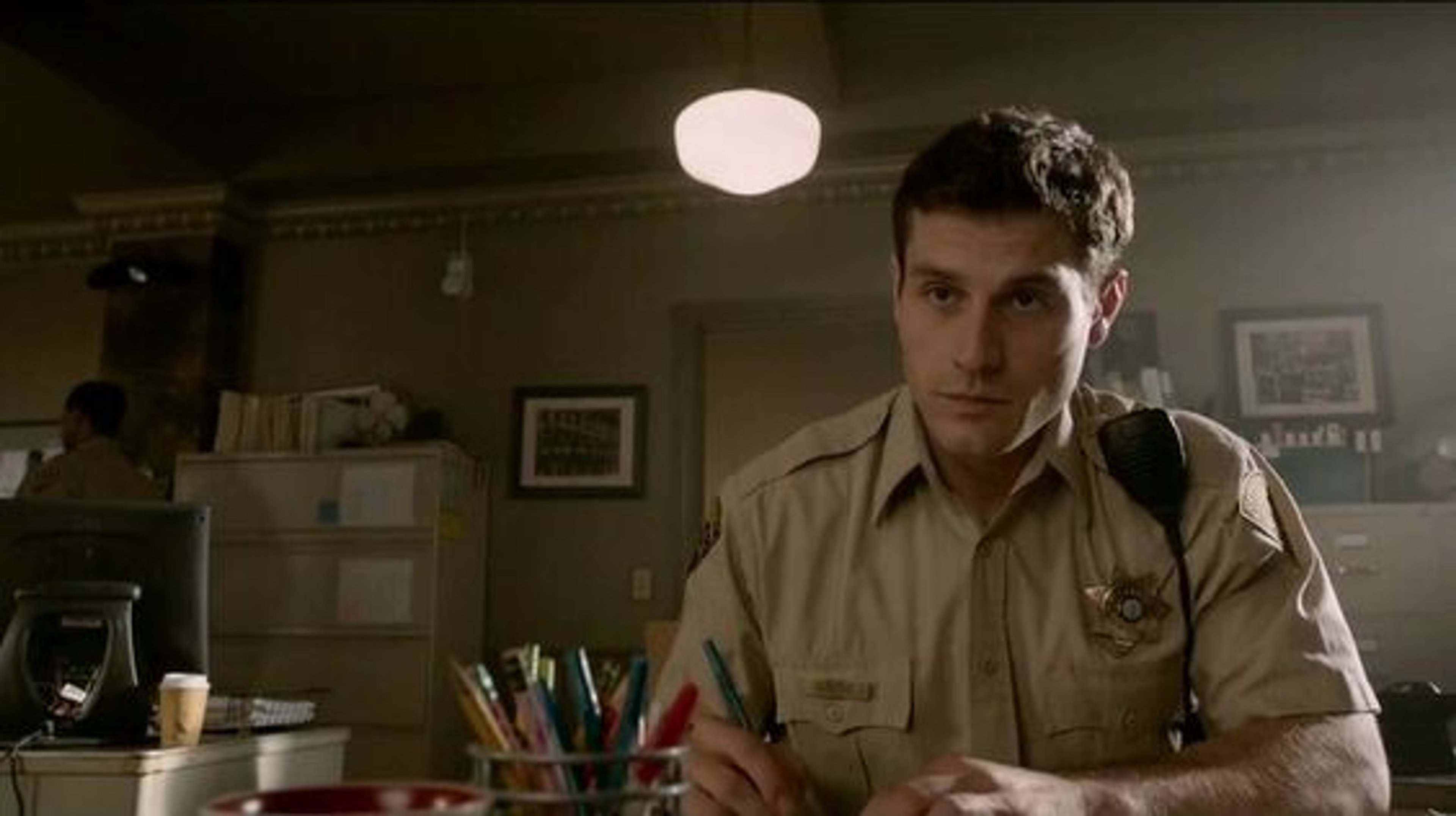 A man in a sheriff's deputy uniform