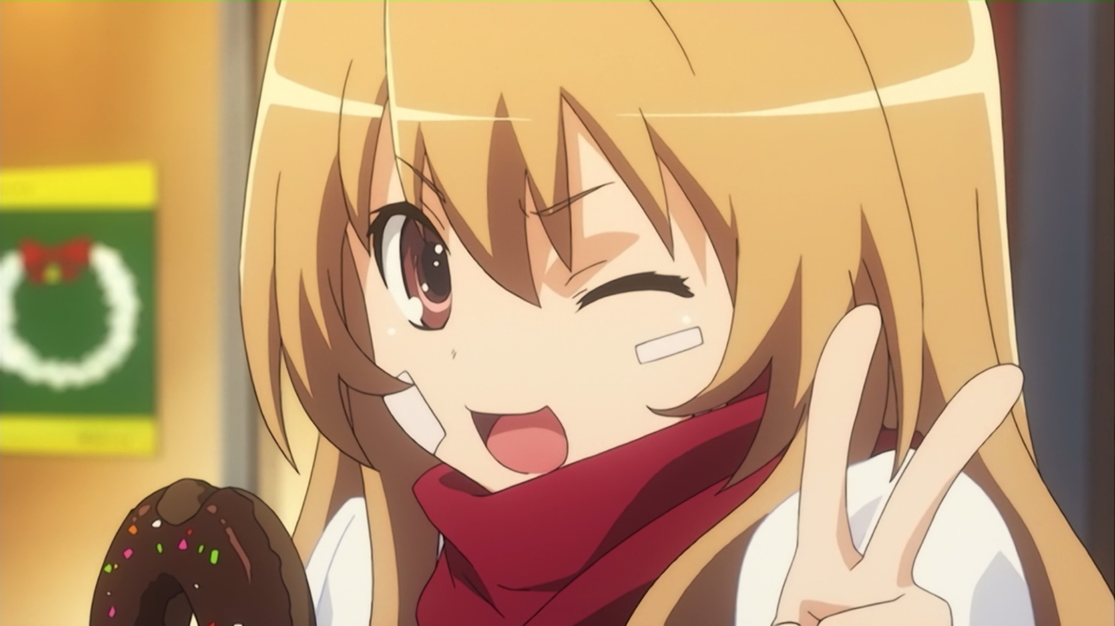 An anime-style character with long orange hair and a red scarf